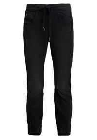 Svart joggingbyxor i denim, med elastisk midja och dragsko, två framfickor och avsmalnande ben med ribbade ärmslut.