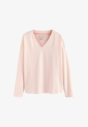 Tričko s dlhým rukávom a výstrihom do V v jemnej ružovej bavne. Voľný strih s minimálnymi švami a hladkou textúrou, s jednoduchým dizajnom.