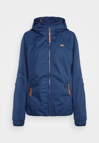 Veste bleu marine avec capuche, fermeture éclair à l'avant, deux poches latérales, poignets élastiques et accents en cuir marron. Tissu lisse et résistant à l'eau.