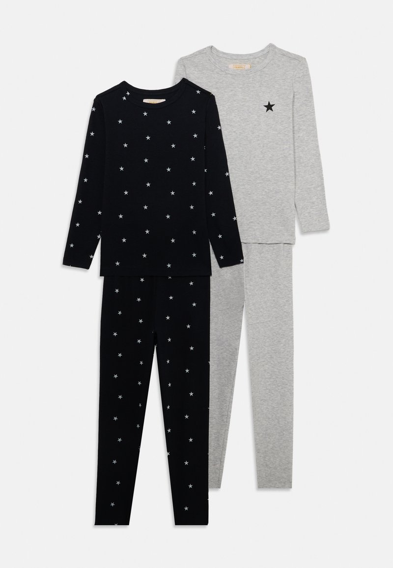 Two sets of pajama tops and bottoms: one black with white star patterns, and one gray with a single black star. Soft cotton material.