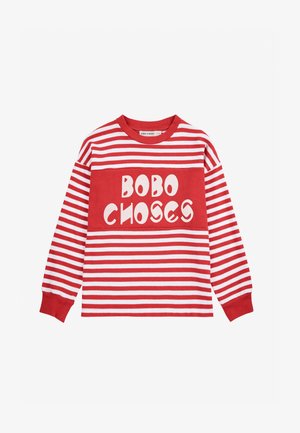 Rot-weiß gestreifte Langarmbluse mit einem auffälligen "BOBO CHOSES"-Grafik auf einem einfarbigen roten Panel. Weicher Baumwollstoff, runder Halsausschnitt.