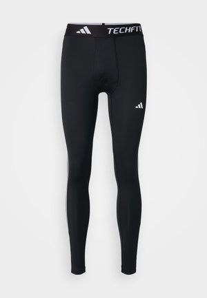 Black athletic tights, fitted design, crafted from smooth, stretchy material. Features a waistband with "TECHFIT" and white logo accents.