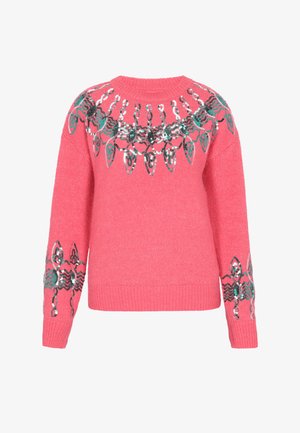 Rózsaszín kötött pulóver zöld, fehér és fekete flitteres absztrakt levél és lánc mintával a mellrészen és az ujjakon.