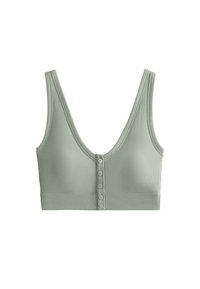 Bralette verde a costine con scollatura a V profonda, spalline larghe e chiusura frontale a cinque bottoni. Tessuto morbido con una texture liscia.