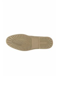 Semelle d'une chaussure beige avec des motifs de bande de roulement texturés et taille 42 marquée près de la voûte plantaire.