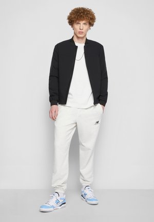 UNI-SSENTIALS - Tracksuit bottoms - sea salt heather