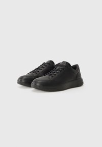 Black athletic shoes made of leather, featuring a rounded toe, lace-up design, padded collar, and textured sole for grip.