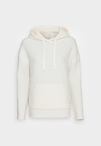 Hoodie de couleur crème avec un motif texturé et côtelé. Il dispose d'une poche kangourou, d'une capuche avec cordon de serrage et de poignets en tricot. Conception décontractée et chaude.