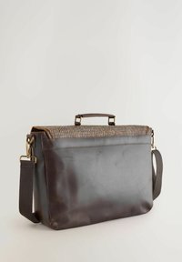 Brown leather bag with a patterned upper section. Features a handle, detachable strap, and metallic hardware accents. Smooth texture.