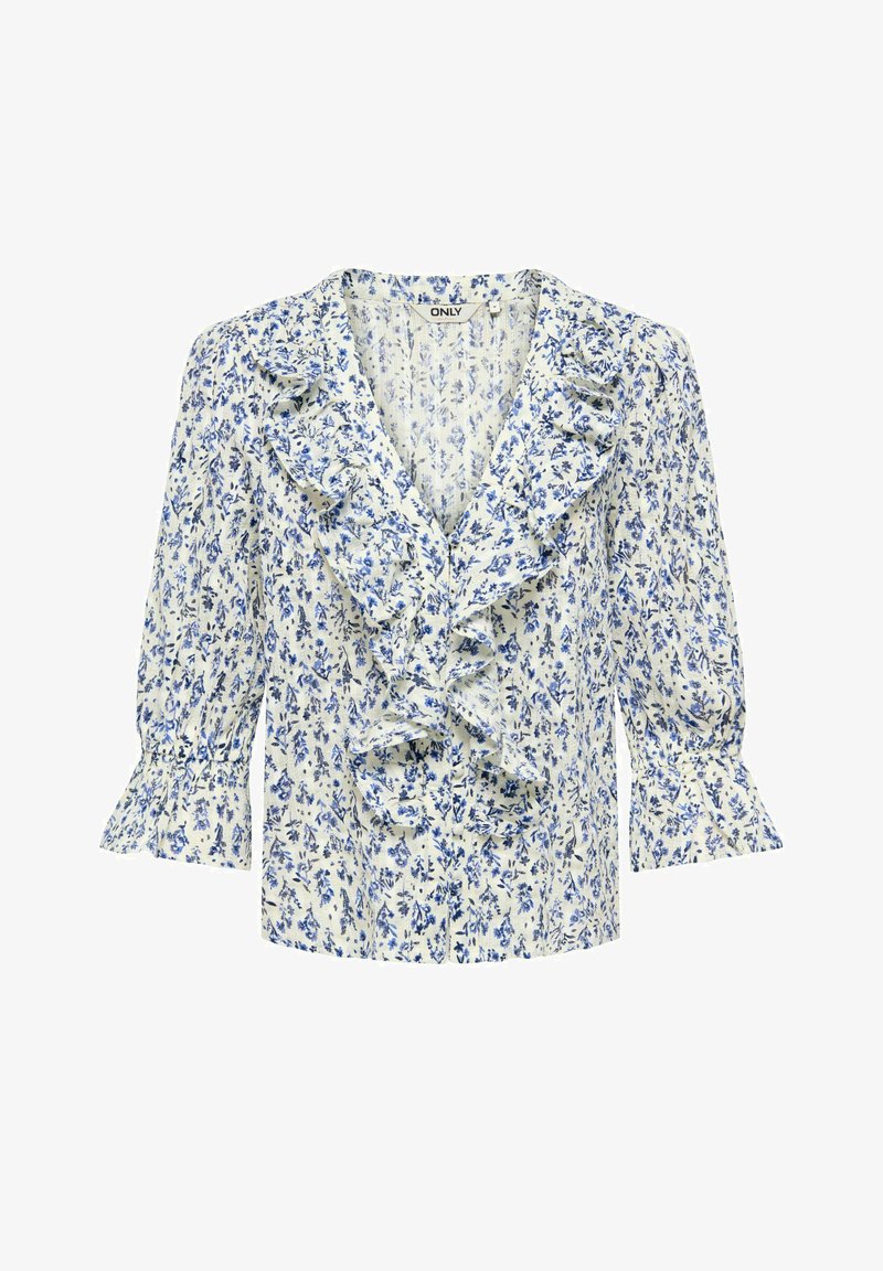 Blouse blanche à motif floral bleu, col en V avec volants au col et à l'avant, et manches trois-quarts avec poignets à volants.