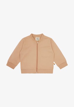 Giacca beige chiaro con zip, colletto rotondo, maniche lunghe e polsini a coste. Presenta un piccolo logo vicino all'orlo. Texture liscia.