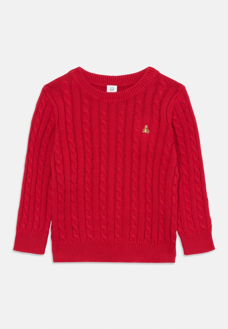 Pull en tricot rouge avec un motif en côtes, col ras du cou et poignets côtelés. Présente un petit emblème doré sur la poitrine.