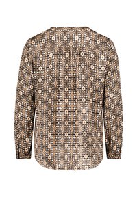 Langärmlige Bluse aus einem floral gemusterten Stoff in Beige, Schwarz und Weiß, mit einem plissierten Rücken und einem Knopfdetail am Hals.