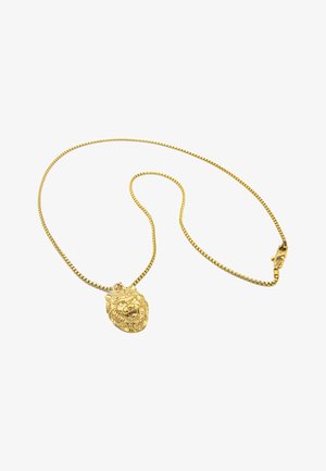 Collier en chaîne en métal doré avec un pendentif en tête de lion. Présente une texture lisse et des détails complexes sur le pendentif.