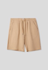 Pantaloni corti beige realizzati in tessuto testurizzato, con vita elasticizzata, cordoncino e due tasche laterali. Orlo finito in modo liscio.