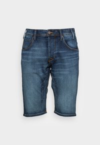 Farkkutrikoot keskisinisessä sävyssä, jossa on napitus, viisi taskua ja keltaista ommelta. Polven pituinen, jossa on lievää haalistumista kankaassa.