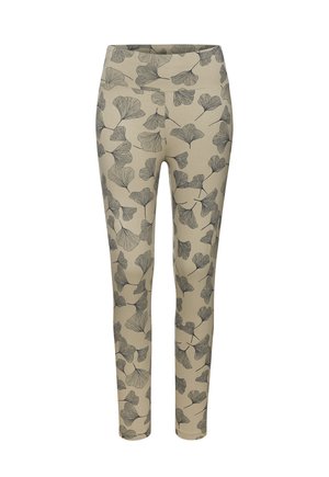 Eng anliegende Leggings aus beigem Stoff mit einem schwarzen Ginkgo-Blatt-Muster, hochtailliertem Design und glatter Textur.