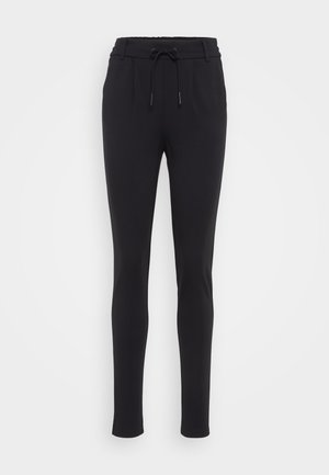 Sorte, tapered joggers laget av et mykt, elastisk stoff. Har en elastisk linning med snor og sidelommer. Glatt tekstur.