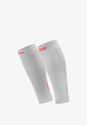 Pair of white compression calf sleeves with pink branding near the top and side, designed for athletic support and muscle recovery.