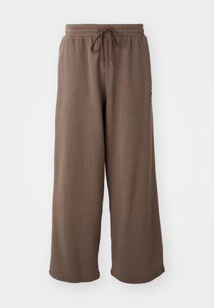 Brune bomulds brede sweatpants med elastisk talje, snøre og en glat struktur. Ingen synlige mønstre eller accenter.