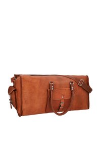 Brown leather duffel bag with a rectangular shape, featuring a detachable shoulder strap, side pocket, and silver-tone hardware accents.