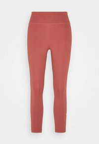 Leggings de cintura alta en un color rosa polvo, hechos de una tela suave y elástica, con una silueta ajustada y un detalle de logo sutil cerca del dobladillo.