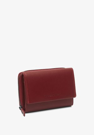 Compact red leather wallet with flap closure and external zippered coin pocket, embossed brand name on front.