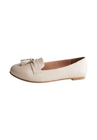 Light beige leather flat shoe with a rounded toe, featuring a decorative tassel on the front and a low-profile sole.