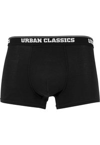 Svarta boxerkalsonger gjorda av mjukt tyg med en tät passform. Har en vit elastisk midja märkt "URBAN CLASSICS." Ingen mönster eller accenter.
