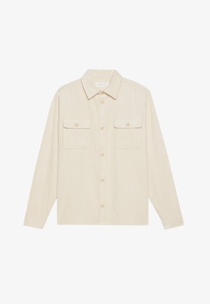 Beežist corduroy-särk pikade varrukatega, terava kraega ja kahe rinna taskuga. Omab nööpidega esist avamist ja tekstuurset kangast.