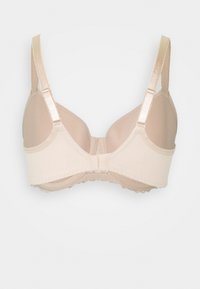 Beige underwire bra with smooth fabric, adjustable straps, and a scalloped trim along the bottom edge. Simple and classic design.