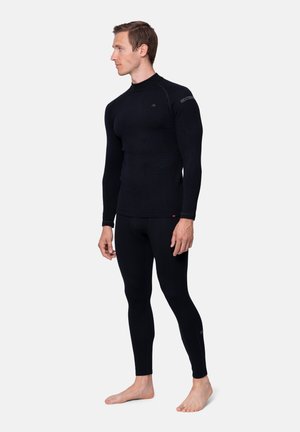 Set termico base nero, composto da una maglia a maniche lunghe e leggings aderenti. Realizzato in tessuto liscio ed elastico con un design elegante.