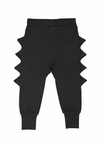 Svarta bomullsbukser med sidospikar, elastisk midja och åtsittande muddar. Slät textur med en lekfull designelement.