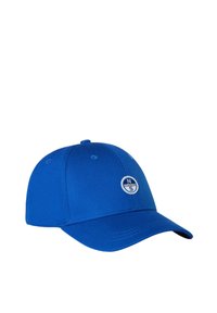 Cappellino blu in cotone con ala curva, dotato di una patch rotonda con logo sul fronte e dettagli di cucitura lungo le cuciture.