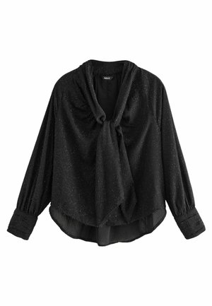 Blouse noire avec un décolleté drapé et un détail en nœud, manches longues avec des poignets froncés, et un tissu texturé avec un subtil éclat.