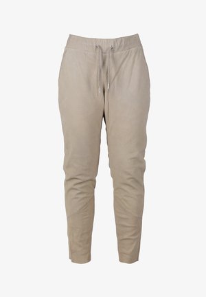 Beige joggingsbroeken van zachte stof, met een elastische tailleband met trekkoorden, zijzakken en taps toelopende pijpen met gestikte accenten.