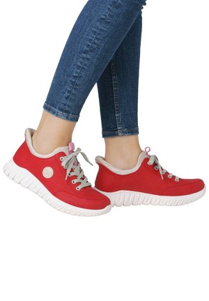 Red leather sneakers with a white rubber sole, grey laces, and pink eyelets. Smooth texture with a round logo detail on the side.