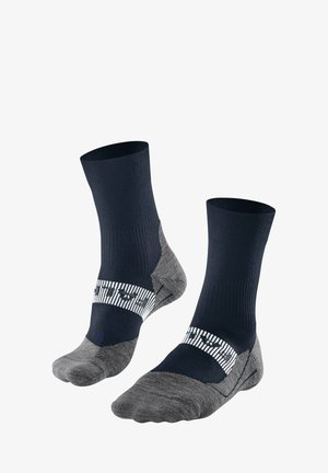 Calzini alla caviglia blu navy e grigi con texture a costine, tallone imbottito e banda bianca a righe con logo. Tessuto morbido per comfort e durata.