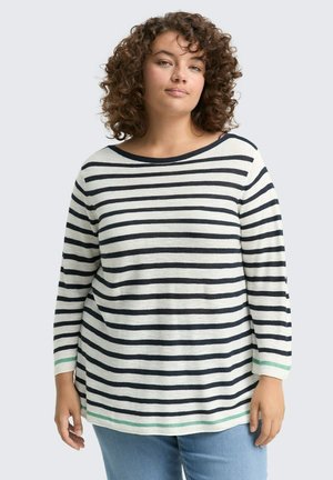 Maglia a maniche lunghe a righe in crema e blu navy, con un ampio scollo e dettagli verdi a contrasto sui polsini e sull'orlo inferiore.