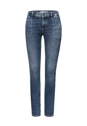 Jeans in denim skinny-fit di colore blu scuro, con vita standard, due tasche anteriori e leggero strappo sul tessuto.