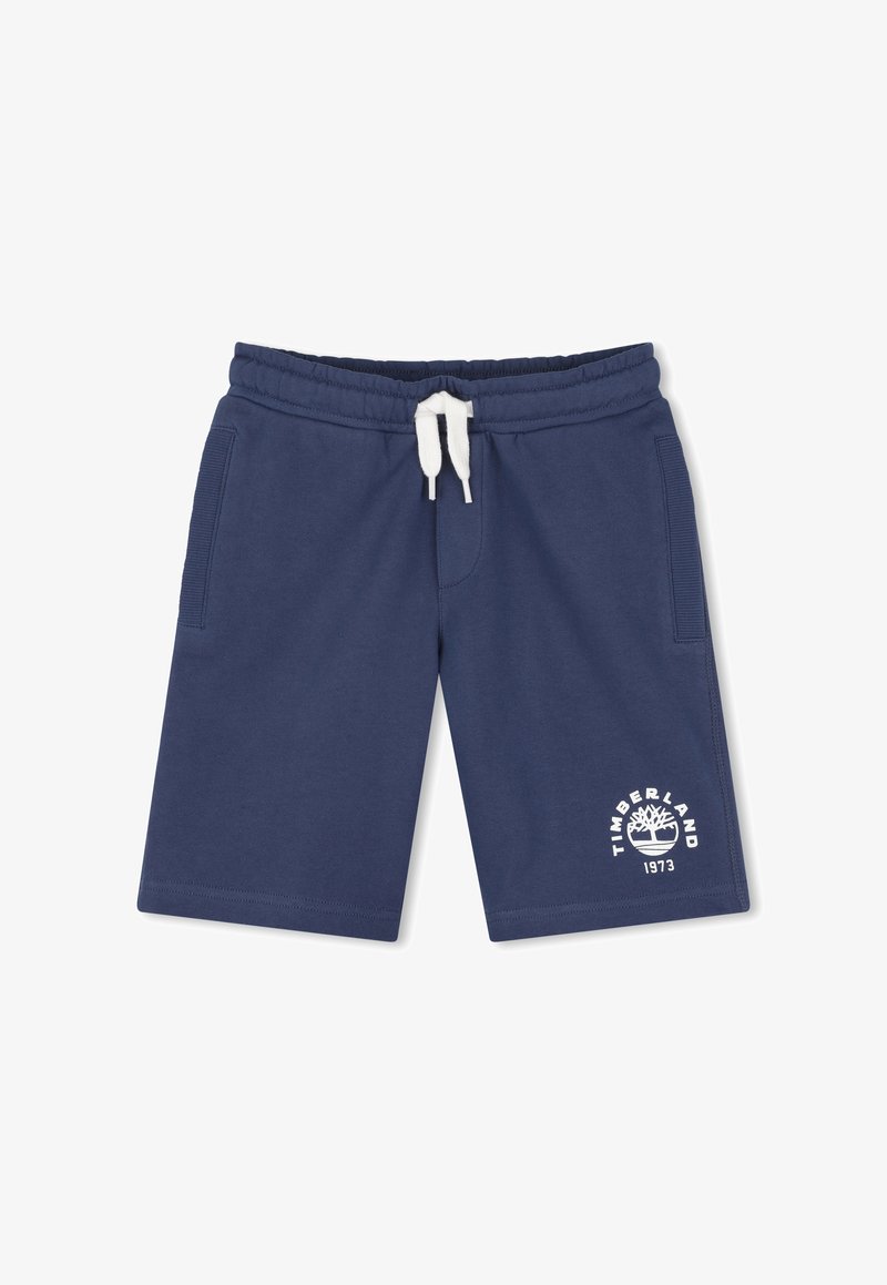 Shorts Timberland bleu marine avec cordon de serrage blanc, poches latérales et logo avec un arbre graphique et "1973" sur la jambe gauche.