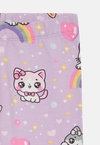 Purple leggings featuring a playful kitten pattern with bows, stars, and rainbows. Soft, stretchy material with an elastic waistband.