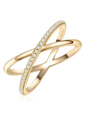 Zlatni prsten s dizajnom u obliku križanja, s glatkom trakom i redom malih prozirnih kamenčića duž jedne strane za dodatnu detaljnost.