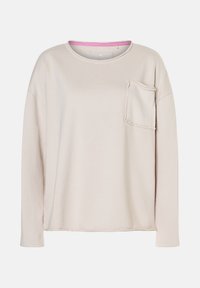 Beige Sweatshirt mit langen Ärmeln, rundem Halsausschnitt, rohem Taschenabschluss auf der linken Brust und pinkem Innenkragen.