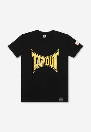 Mustast puuvillast t-särk, mille esiküljel on suur kulunud kollane "TAPOUT" logo. Alumises vasakus nurgas on väike brändi silt.