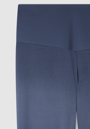 Leggings blu navy con una trama liscia e una vita alta. Il tessuto presenta una leggera lucentezza, affusolandosi verso la caviglia.