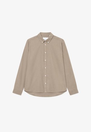 Beige long-sleeve button-up shirt with a pointed collar, front buttons, and a rounded hem. Textured fabric with subtle sheen.