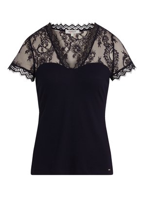 Black top featuring a ribbed fabric body and sheer lace short sleeves with floral pattern and scalloped edges. V-neck design.
