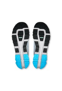Shoe outsole featuring a black rubber grip pattern with blue accents and a white midsole. Textured areas enhance traction and support.