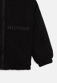 Tommy Hilfiger LIGHT PADDED RIBSTOP - Light jacket - black